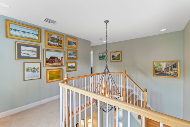staircase featuring carpet floors, baseboards, a chandelier, and recessed lighting