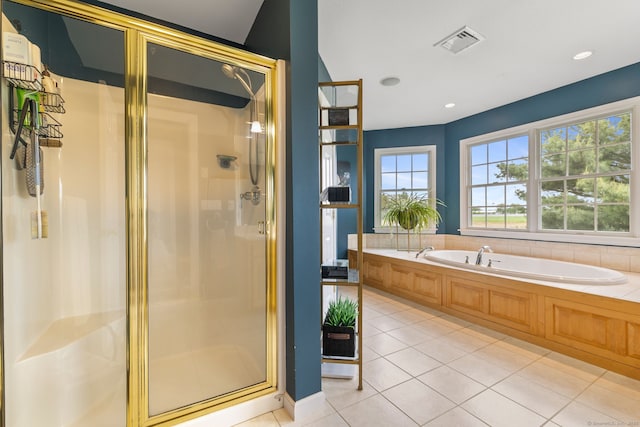 full bath with a shower stall, a garden tub, and tile patterned flooring