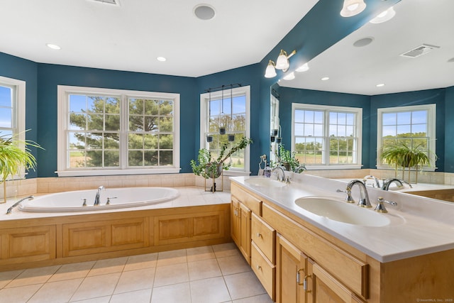 full bathroom featuring a bath, double vanity, tile patterned flooring, and recessed lighting