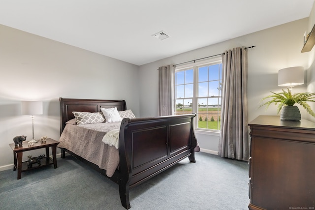 carpeted bedroom featuring baseboards