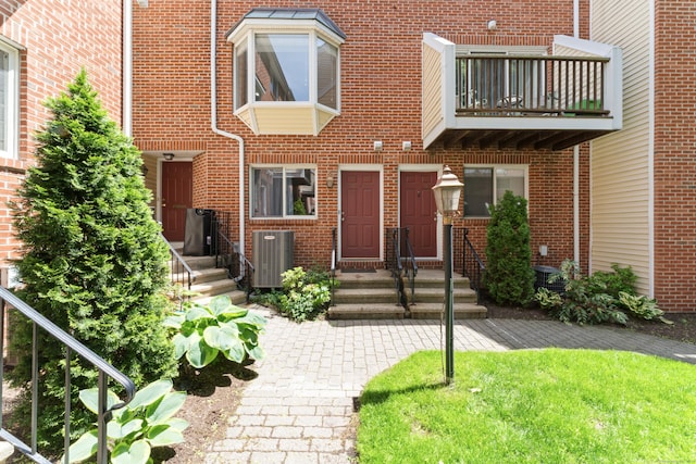 101 Grove St Apt 19, Stamford, CT 06901 - property entrance with brick siding, central AC, and a balcony
