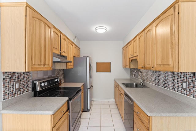 101 Grove St Apt 19, Stamford, CT 06901 - kitchen featuring appliances with stainless steel finishes, a sink, baseboards, under cabinet range hood, and decorative backsplash