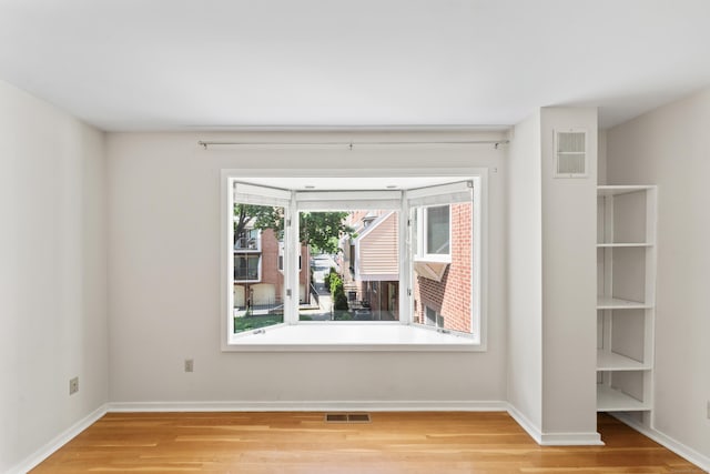 101 Grove St Apt 19, Stamford, CT 06901 - spare room with wood finished floors and baseboards