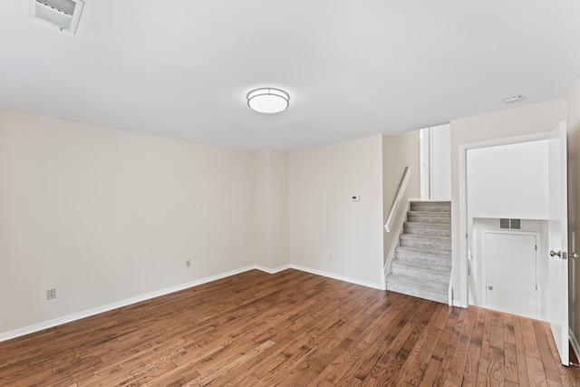 101 Grove St Apt 19, Stamford, CT 06901 - basement featuring wood finished floors, stairs, and baseboards