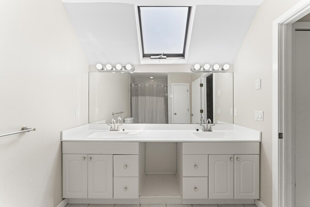 101 Grove St Apt 19, Stamford, CT 06901 - full bath with a skylight, double vanity, baseboards, and a shower with curtain