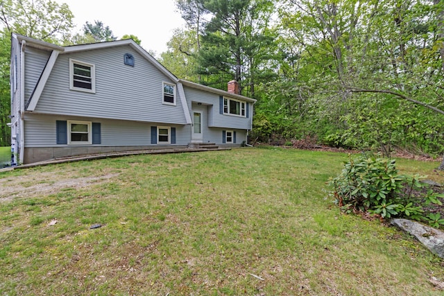 9 Berkshire Dr, East Hampton, CT 06424 - bi-level home featuring a chimney and a front lawn