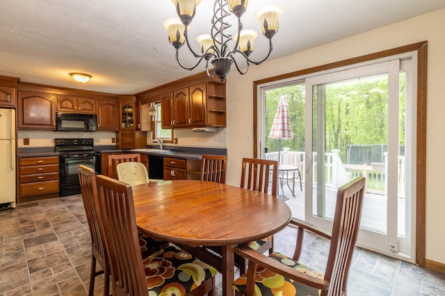 9 Berkshire Dr, East Hampton, CT 06424 - dining room featuring a chandelier and stone finish flooring
