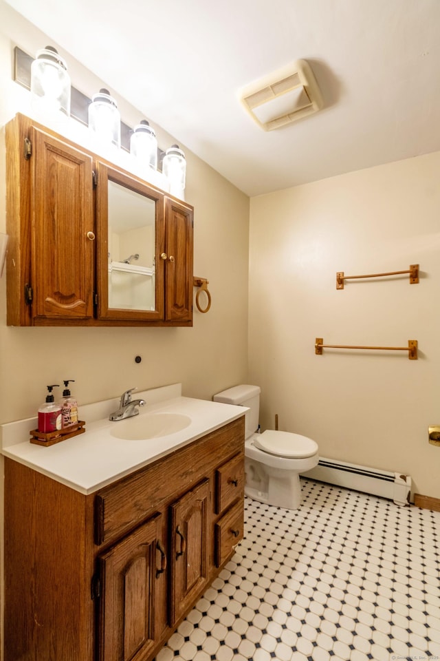 9 Berkshire Dr, East Hampton, CT 06424 - bathroom featuring a baseboard heating unit, toilet, and vanity