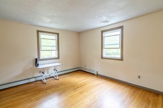 9 Berkshire Dr, East Hampton, CT 06424 - unfurnished room featuring healthy amount of natural light, wood finished floors, baseboards, and baseboard heating