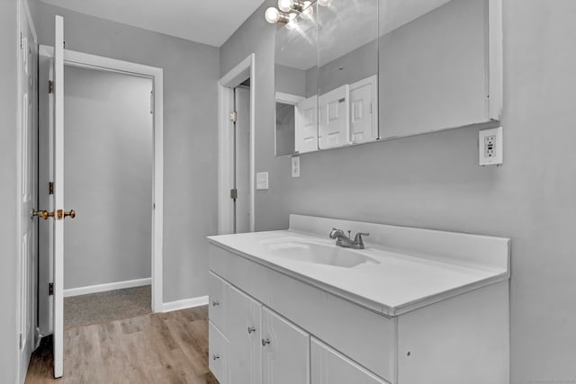 6 Marbil Rd, Danbury, CT 06811 - bathroom with wood finished floors, vanity, and baseboards
