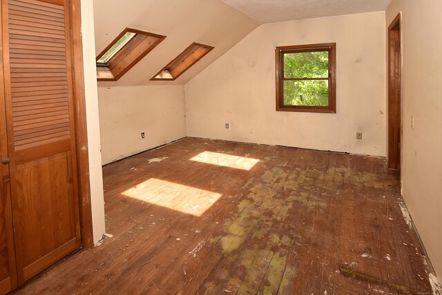 1152 Hartford Tpke, Vernon, CT 06066 - bonus room featuring hardwood / wood-style floors, lofted ceiling, and a skylight