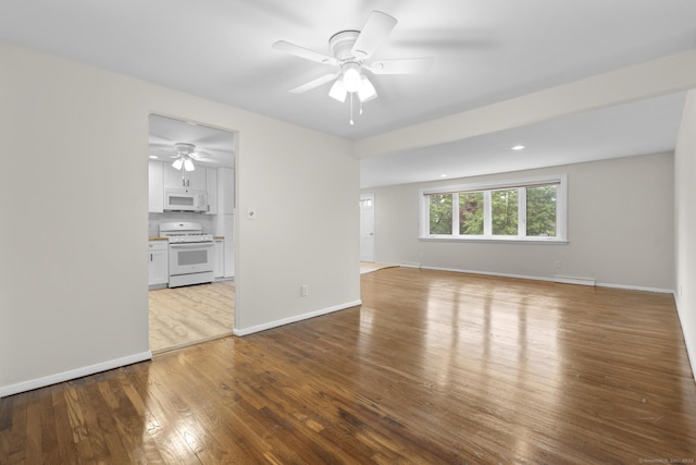 110 Hesse Rd, Hamden, CT 06517 - unfurnished living room with a ceiling fan, wood finished floors, and baseboards