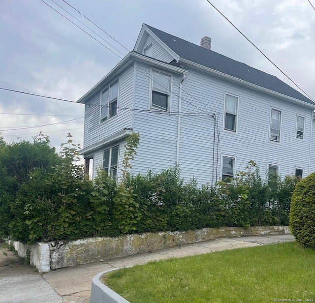 92 Alice St, Bridgeport, CT 06606 - view of property exterior featuring a chimney