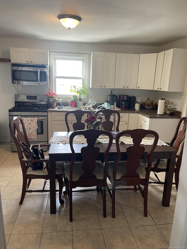 92 Alice St, Bridgeport, CT 06606 - dining space featuring light tile patterned flooring