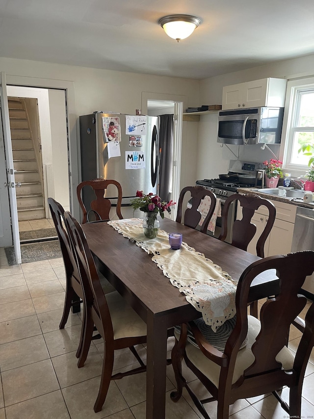 92 Alice St, Bridgeport, CT 06606 - dining area featuring stairs and light tile patterned floors
