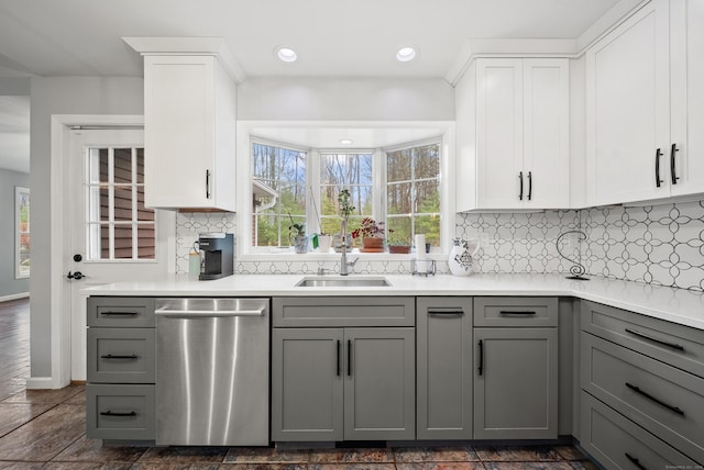 108 Lohse Rd, Willington, CT 06279 - kitchen with stainless steel dishwasher, gray cabinetry, a sink, decorative backsplash, and light countertops