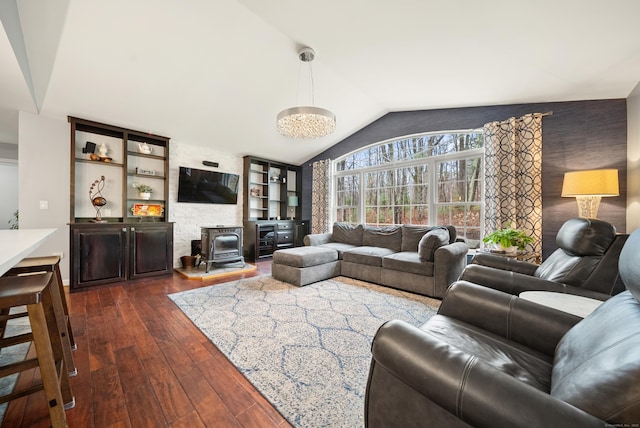 108 Lohse Rd, Willington, CT 06279 - living area with vaulted ceiling, a wood stove, and dark wood finished floors