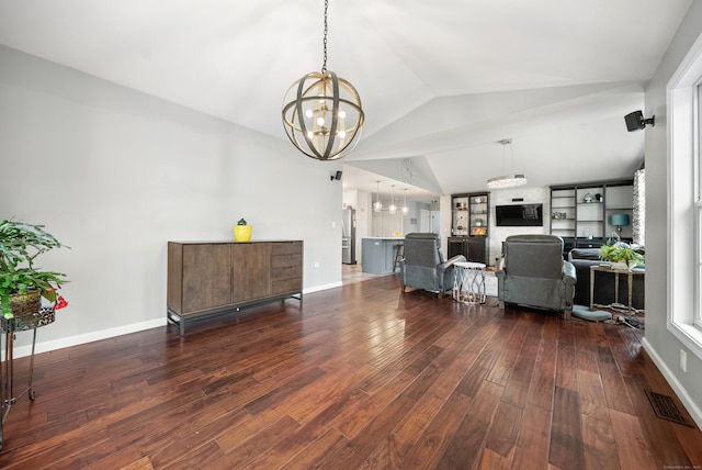 108 Lohse Rd, Willington, CT 06279 - living area with a chandelier, vaulted ceiling, dark wood-style floors, and baseboards