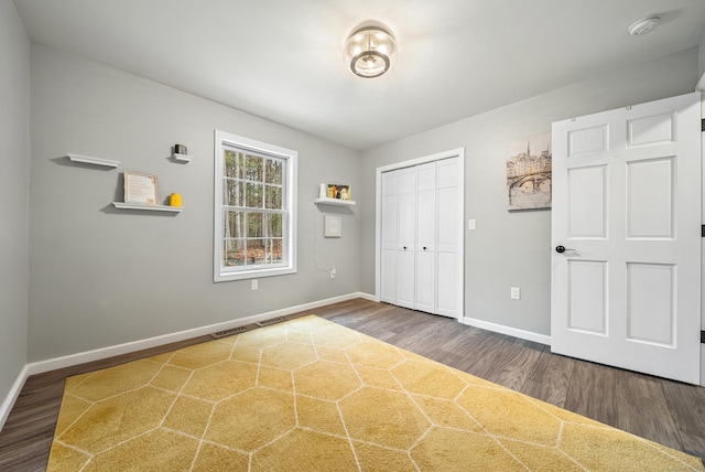 108 Lohse Rd, Willington, CT 06279 - unfurnished bedroom featuring wood finished floors, baseboards, and a closet