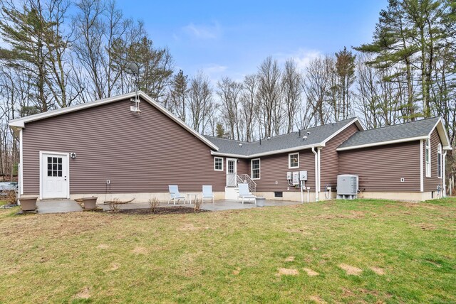 108 Lohse Rd, Willington, CT 06279 - back of house featuring a patio, a yard, roof with shingles, and cooling unit