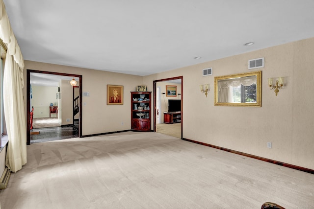 1 Nod Brook Dr, Simsbury, CT 06070 - spare room featuring light colored carpet and baseboards