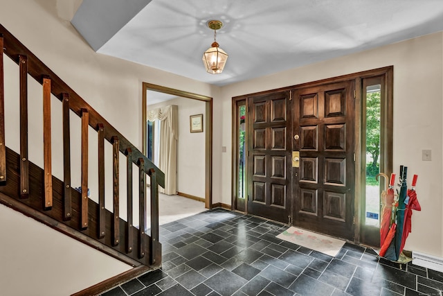 1 Nod Brook Dr, Simsbury, CT 06070 - foyer featuring dark stone finish floors and baseboards