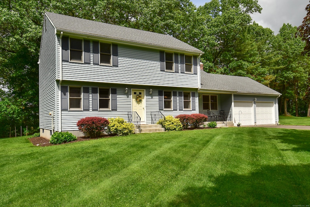 14 Ellsworth Ln, Ellington, CT 06029 - colonial house with a garage, a front lawn, and asphalt driveway