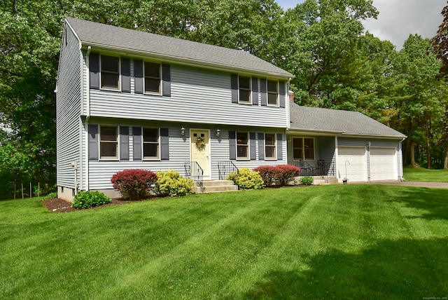 14 Ellsworth Ln, Ellington, CT 06029 - colonial house with a garage, a front lawn, and asphalt driveway