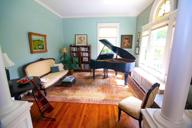 27 Church St, Groton, CT 06340 - living area featuring wood finished floors, plenty of natural light, ornamental molding, and ornate columns
