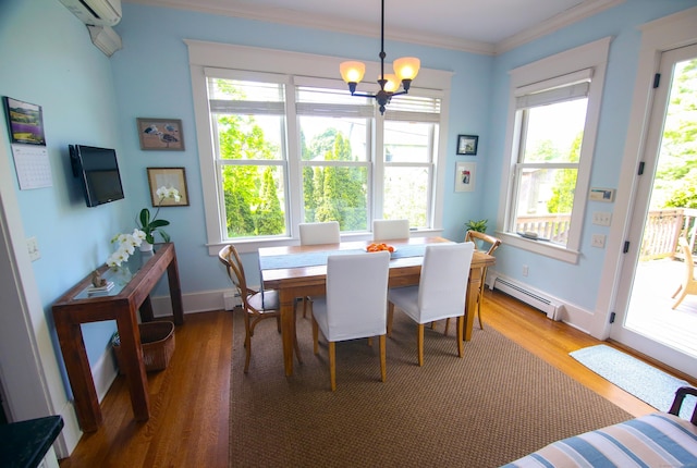 27 Church St, Groton, CT 06340 - dining room with a baseboard heating unit, crown molding, a chandelier, wood finished floors, and an AC wall unit