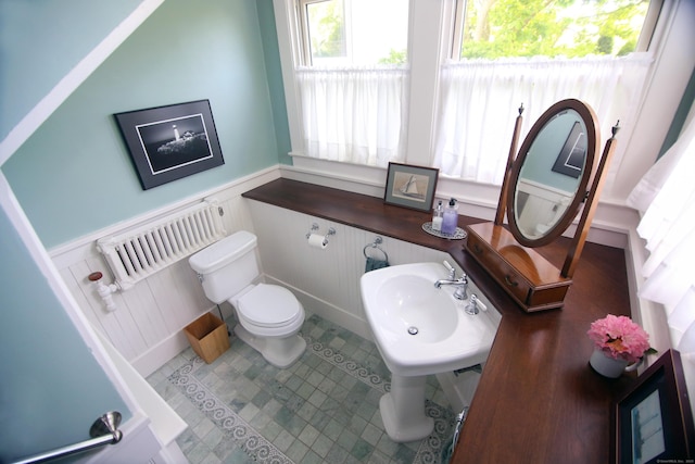 27 Church St, Groton, CT 06340 - bathroom featuring wainscoting, a decorative wall, tile patterned floors, and radiator