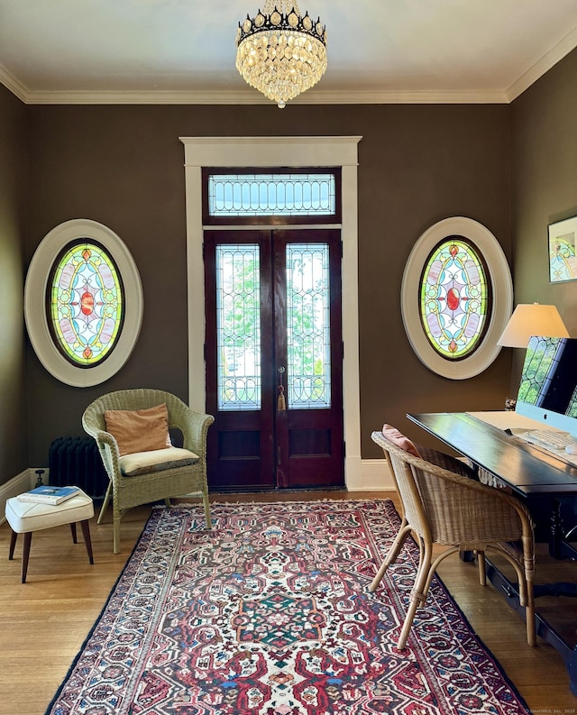 27 Church St, Groton, CT 06340 - foyer with wood finished floors, french doors, a chandelier, and ornamental molding