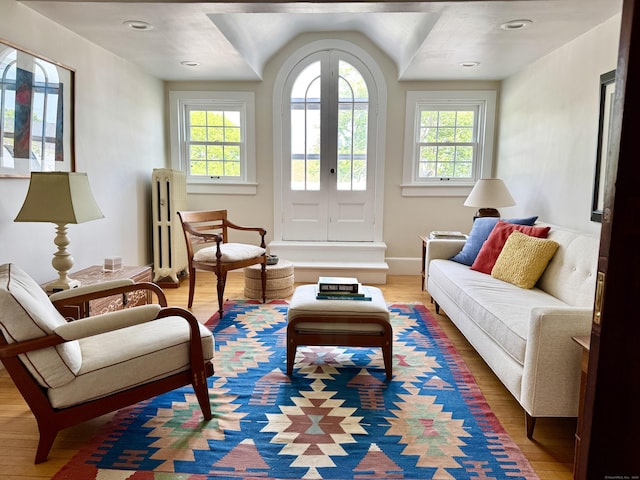27 Church St, Groton, CT 06340 - living room with plenty of natural light, light wood finished floors, and french doors