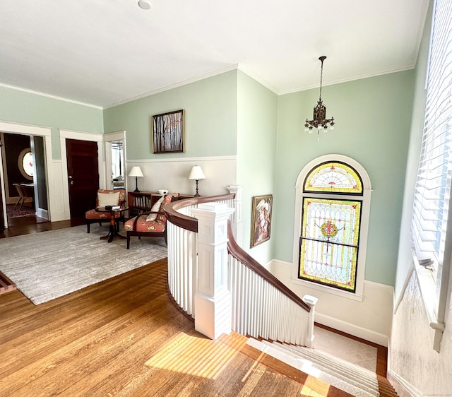 27 Church St, Groton, CT 06340 - entryway with wood finished floors, a chandelier, and ornamental molding