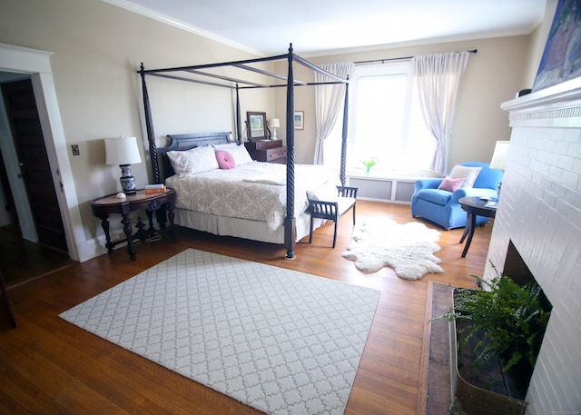 27 Church St, Groton, CT 06340 - bedroom with a fireplace, crown molding, and wood finished floors