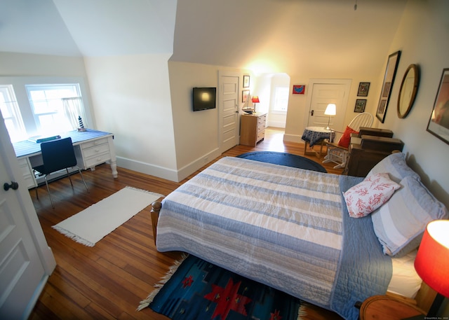 27 Church St, Groton, CT 06340 - bedroom with lofted ceiling, wood finished floors, and arched walkways