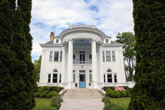 27 Church St, Groton, CT 06340 - neoclassical / greek revival house featuring a balcony, a chimney, and covered porch
