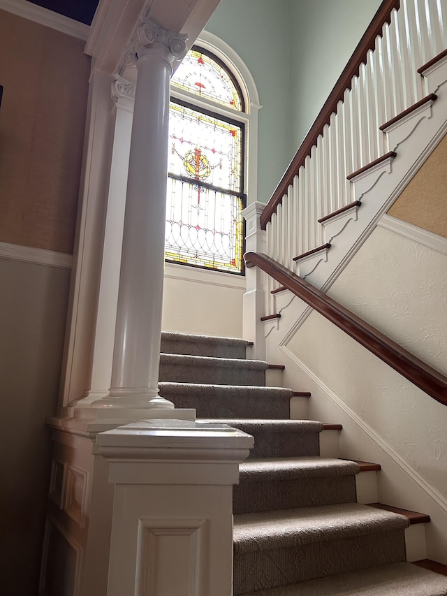 27 Church St, Groton, CT 06340 - staircase featuring decorative columns and crown molding