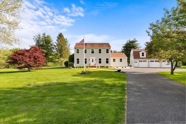 299 W Flat Hill Rd, Southbury, CT 06488 - colonial inspired home featuring a front lawn, a detached garage, and asphalt driveway