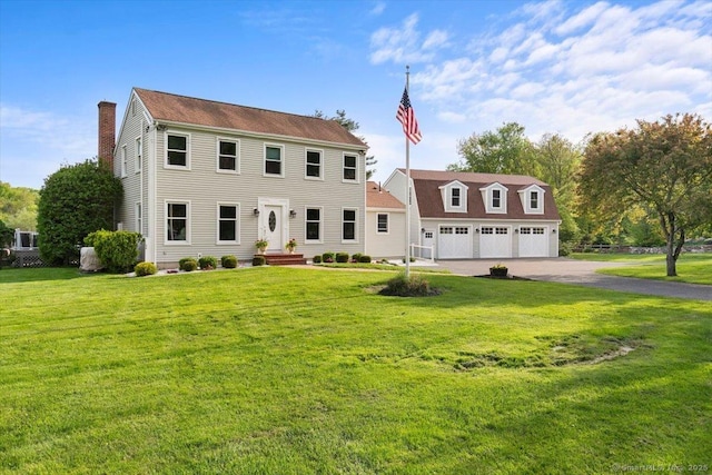 299 W Flat Hill Rd, Southbury, CT 06488 - colonial house featuring a chimney, a front lawn, a detached garage, and asphalt driveway
