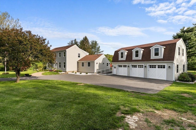 299 W Flat Hill Rd, Southbury, CT 06488 - view of front of home featuring a gambrel roof, a front yard, driveway, and roof with shingles