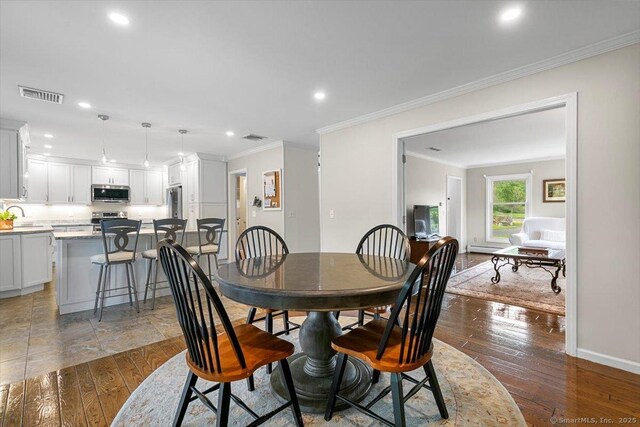 299 W Flat Hill Rd, Southbury, CT 06488 - dining room featuring recessed lighting, hardwood / wood-style flooring, crown molding, and baseboards