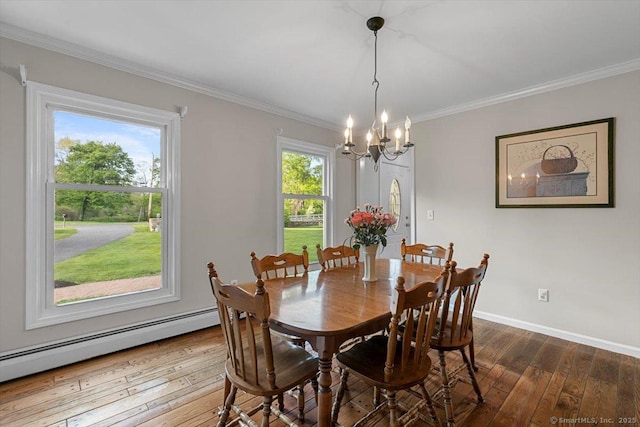 299 W Flat Hill Rd, Southbury, CT 06488 - dining area with a baseboard radiator, a chandelier, dark wood finished floors, crown molding, and baseboards