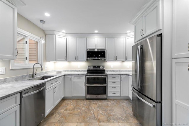 299 W Flat Hill Rd, Southbury, CT 06488 - kitchen with appliances with stainless steel finishes, a sink, stone finish flooring, white cabinetry, and recessed lighting