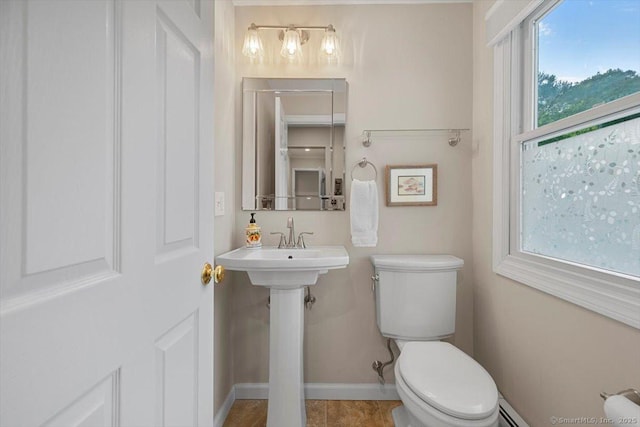 299 W Flat Hill Rd, Southbury, CT 06488 - bathroom with healthy amount of natural light, toilet, baseboards, and baseboard heating