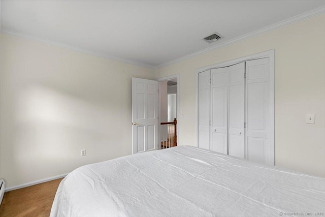 299 W Flat Hill Rd, Southbury, CT 06488 - bedroom with carpet floors, crown molding, a baseboard radiator, baseboards, and a closet