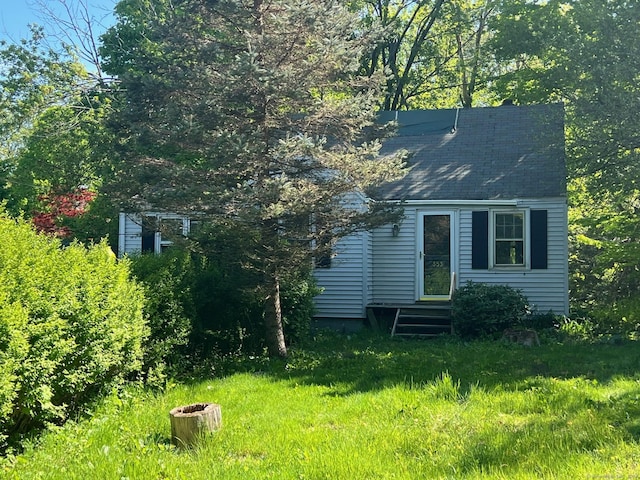 back of property featuring entry steps