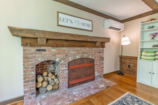 12 Sandy Ln, Marlborough, CT 06447 - detailed view of a wall unit AC, wood finished floors, baseboards, and a fireplace