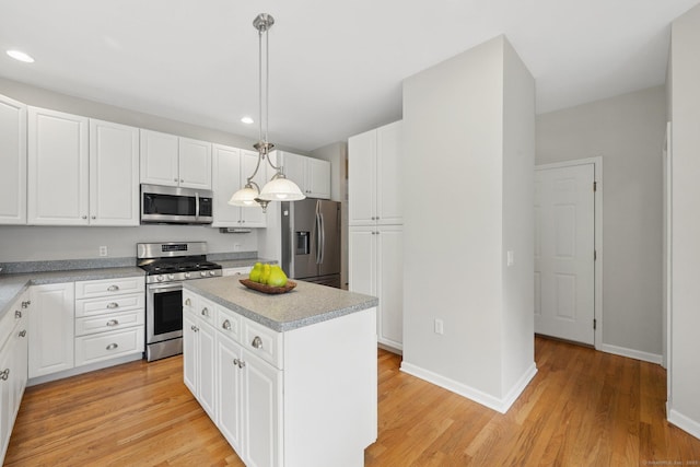 107 Chestnut Hill Rd Unit 107, Portland, CT 06480 - kitchen with stainless steel appliances, recessed lighting, white cabinets, light wood-style floors, and baseboards