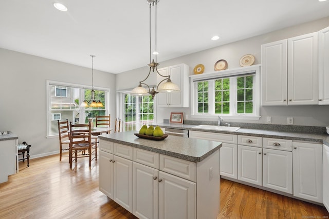 107 Chestnut Hill Rd Unit 107, Portland, CT 06480 - kitchen with a sink, white cabinets, recessed lighting, and a kitchen island